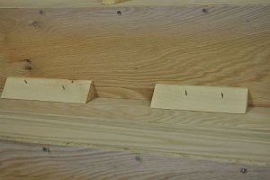 Photo of risers glued and screwed to back of treads.